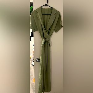 Rowangirl V neck casual jumpsuit with a button front and tie waist